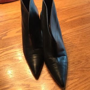 Black leather heeled ankle boots.